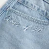 Mini-saia-calça de ganga de cintura baixa Classe de ’26
