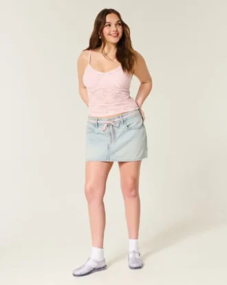 Mini-saia-calça em ganga clara com atacadores