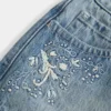 Mini-saia-calça em ganga de cintura ultra baixa