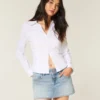 Mini-saia-calça jeans clara com tachas Mini-saia-calça jeans clara com tachas