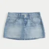 Mini-saia-calça jeans clara com tachas Mini-saia-calça jeans clara com tachas