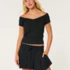 Mini-saia-calça plissada de cintura média