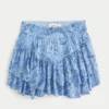 Mini-saia com bainha assimétrica em camadas Mini-saia com bainha assimétrica em camadas