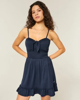 Mini vestido de malha com laço à frente