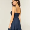 Mini vestido de malha com laço à frente