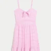 Mini vestido de malha com laço à frente