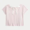 T-shirt com padrão floral e laço fácil de atar nas costas