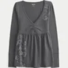 Top babydoll com mangas compridas e estampado Top babydoll com mangas compridas e estampado