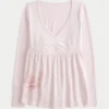 Top babydoll com mangas compridas e estampado