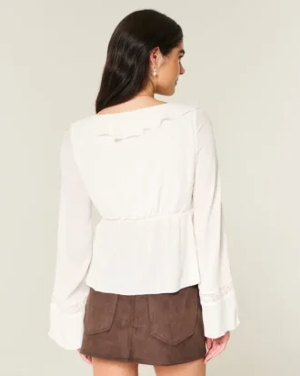 Top babydoll de manga comprida com folhos