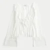Top babydoll de manga comprida com folhos