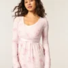 Top babydoll de manga comprida com frente cruzada