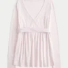 Top babydoll de manga comprida com frente cruzada