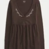 Top babydoll de manga comprida com pinças no peito