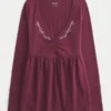 Top babydoll de manga comprida com pinças no peito