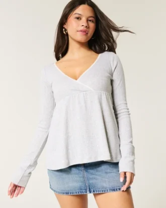 Top babydoll de manga comprida com ponto aberto