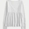 Top babydoll de manga comprida com ponto aberto Top babydoll de manga comprida com ponto aberto