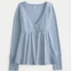 Top babydoll de manga comprida com ponto aberto Top babydoll de manga comprida com ponto aberto