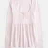 Top babydoll Henley de manga comprida