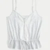 Top com peplum e detalhes em renda