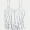 Top com peplum e detalhes em renda