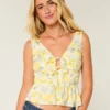 Top peplum com laço frontal em mistura de linho