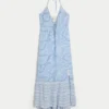 Vestido maxi assimétrico com decote halter
